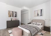 Thumbnail 19 of 21 - A bedroom with a large bed and two paintings on the wall at One 333, Chicago, IL