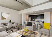 Thumbnail 8 of 21 - A modern living room with grey couches and a black and white rug at One 333, Chicago, 60605