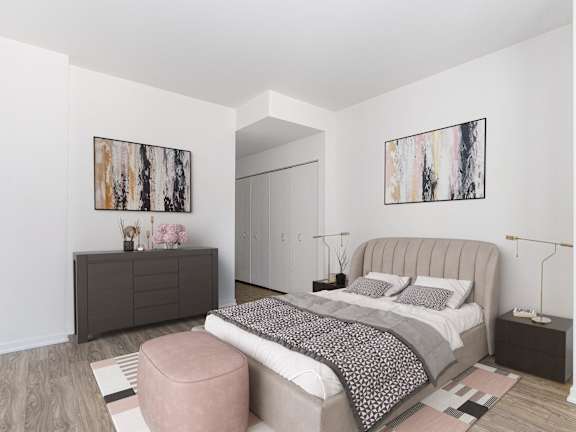 A bedroom with a large bed and two paintings on the wall at One 333, Chicago, IL