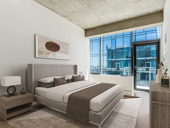 A bedroom with a large bed and a large window at One 333, Chicago, IL