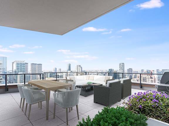 a balcony with a view of a city and a table and chairs at Cassidy on Canal, Chicago, IL