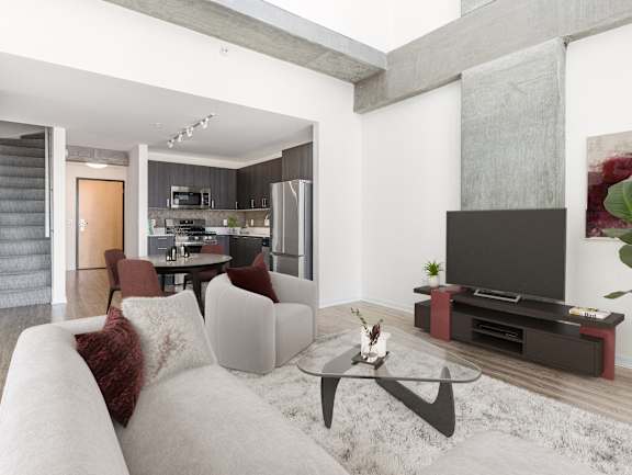 A modern living room with a grey couch and a black coffee table at One 333, Chicago, IL, 60605