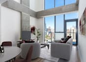 Thumbnail 13 of 21 - A modern living room with a view of the city at One 333, Illinois, 60605
