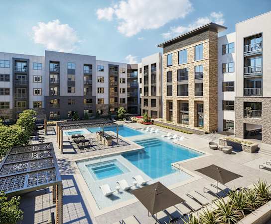 an aerial view of an apartment complex with a swimming pool
