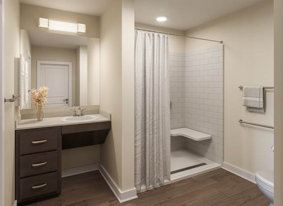 A bathroom with a white sink and a white toilet. at Divinity Landing Apartments, Macedonia, 44056