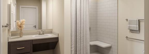 A bathroom with a white sink and a white toilet.