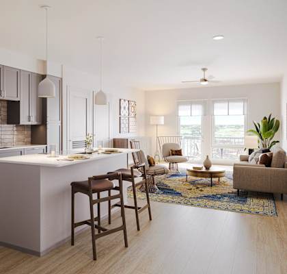 A modern kitchen with a large island and wooden floors.