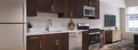 A modern kitchen with wooden cabinets and stainless steel appliances.
