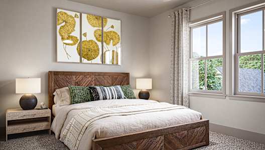 A bedroom with a large bed and a ceiling fan.at Allier Gulf Shores, Gulf Shores Alabama