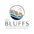 The logo for The Bluffs at Carlsbad Apartments features a graphic of a cliff with birds flying around it.