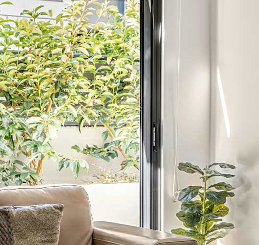 a living room with a couch and a window