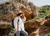 Thumbnail 3 of 55 - A woman is standing on a rocky hill at Bautista Apartments, Tucson, 85745