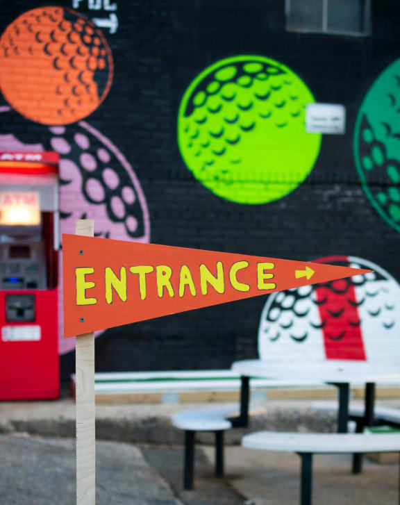a sign that says entrance in front of a building