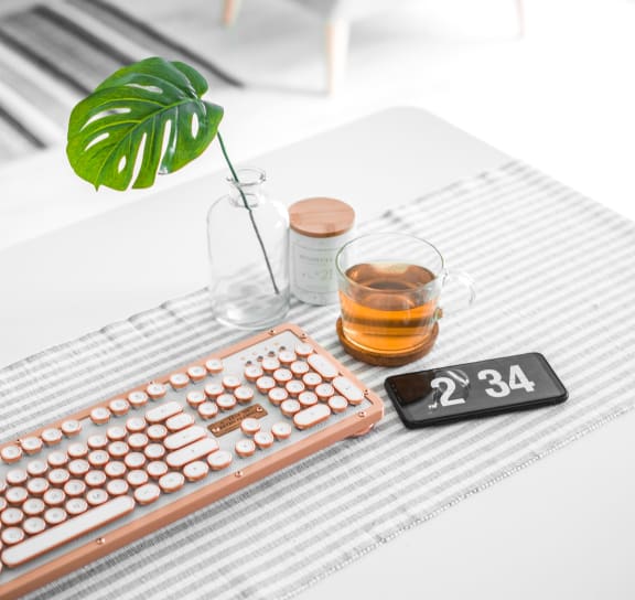 a laptop and a keyboard on a table