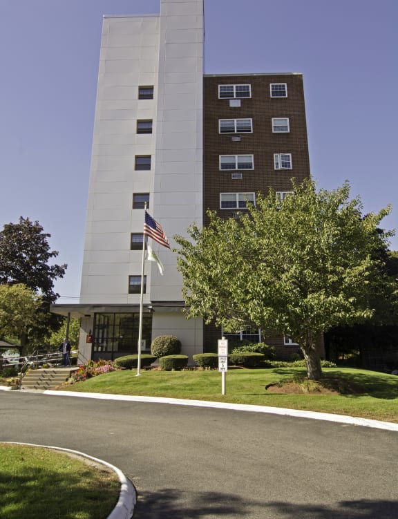 an apartment building in a city parking lot
