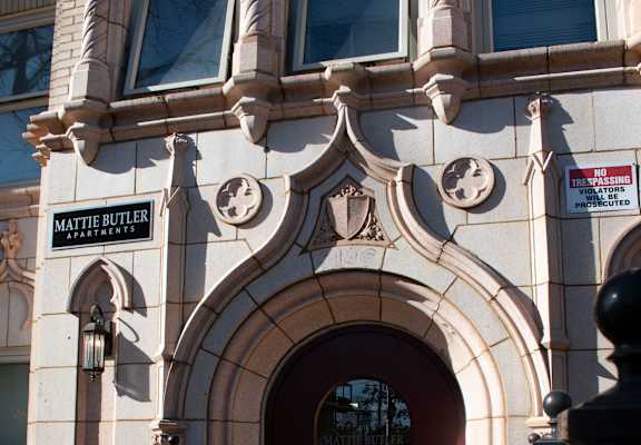 the front of a building with a red door