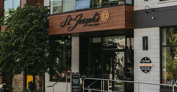 A modern building with a brown and white facade and a sign that reads "The Junction".