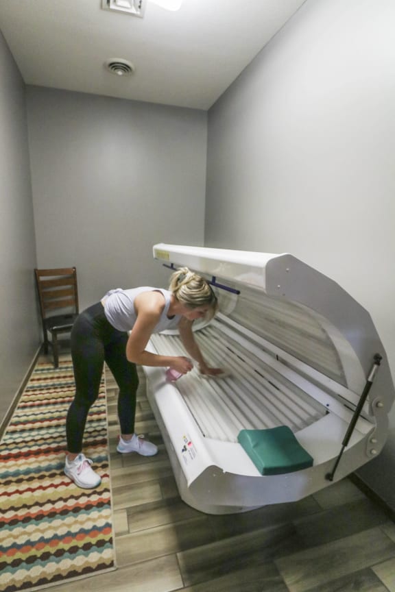 a woman is working on a bench in a hospital room at Boulder Ridge, Duluth