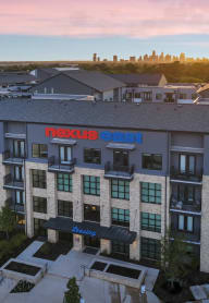 an aerial view of the nelsonsi building at sunset