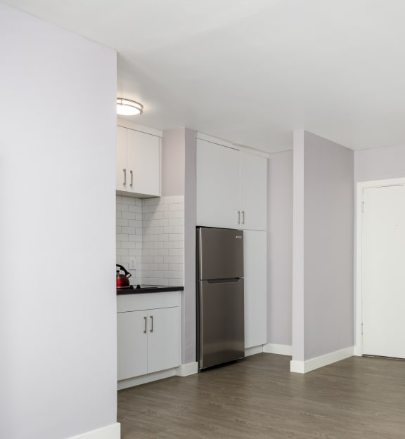 a kitchen and living room in a 555 waverly unit