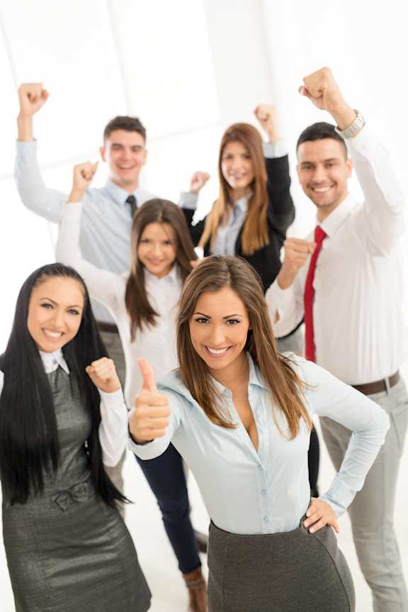 A group of business people are celebrating with thumbs up and fists raised.