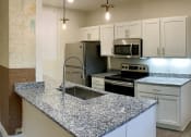 Thumbnail 5 of 20 - Typical Kitchen Finish at San Sofia Luxury Apartments , Integrity Realty LLC, Cleveland