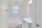 a bathroom with a toilet sink and bathtub