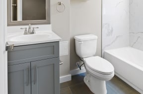 a bathroom with a sink toilet and bathtub
