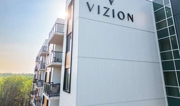 the facade of a building with the vixon logo on it