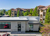 Thumbnail 26 of 28 - A modern house with a red car parked in front. at Siena Villas Apartments, Utah