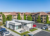 Thumbnail 24 of 28 - A modern building with a parking lot in front of it. at Siena Villas Apartments, Orem, 84097