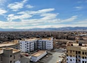 Thumbnail 3 of 8 - a view of a city from the roof of a building