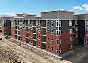 Thumbnail 1 of 8 - an aerial view of an apartment building in a construction site