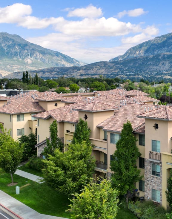 A mountain range is in the background of a residential area. at Siena Villas Apartments, Orem, UT