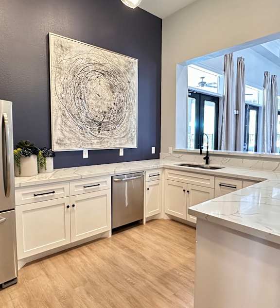 a kitchen with a counter top and a sink at Waterstone at Cinco Ranch, Katy, TX, 77450