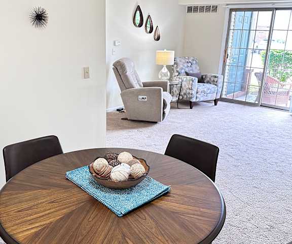 a dining room and living room with a table with balls on it