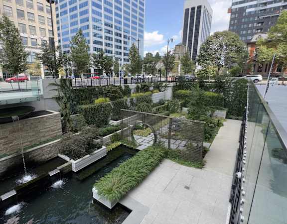 a park with a river in the middle of a city at Preston Centre, Columbus, Ohio