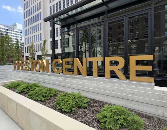 a building with a large golden sign on the front of it at Preston Centre, Columbus, Ohio, 43215