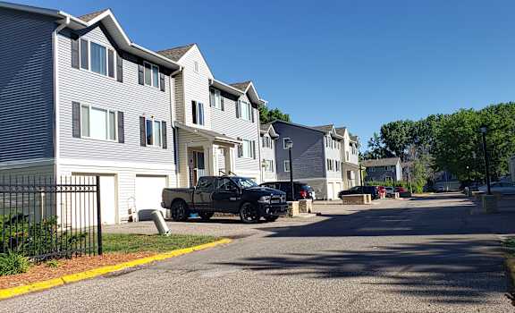 a truck parked on a street in front of houses