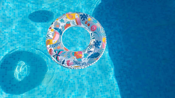 a colorful inflatable circle in a swimming pool