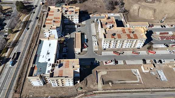 an aerial view of a neighborhood with rows of houses