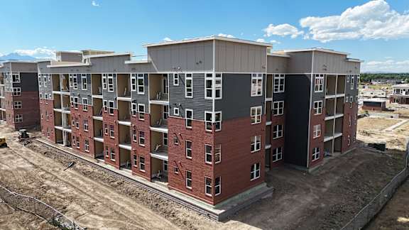 an aerial view of an apartment building in a construction site