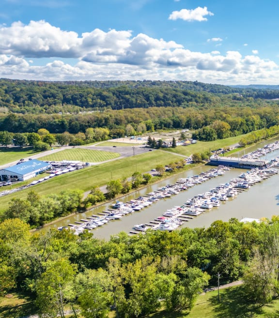 an aerial view of a boat marina next to a river