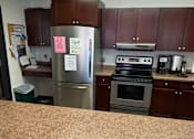 Thumbnail 11 of 18 - Community Room Kitchen View 2