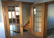 Thumbnail 4 of 6 - A wooden window with a white frame is open.