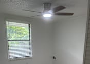 Thumbnail 4 of 28 - A ceiling fan is mounted on a white ceiling.