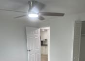 Thumbnail 8 of 28 - A white ceiling fan with a light on it.