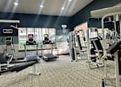 Thumbnail 18 of 21 - Fully equipped gym at Irving TX apartments that accept cosigners