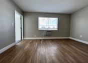 Thumbnail 6 of 12 - an empty room with a window and a wood ceiling  at Palm Gardens @ Biscayne Gardens, North Miami, FL