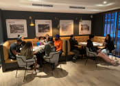 Thumbnail 7 of 7 - a group of people sitting around a table